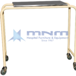 Hospital overbed table with a stainless steel top on a cream powder-coated tubular steel frame, open on one side, on four swivel castors