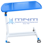 Hospital overbed table with a one-piece blue ABS top, raised rim, built-in cup holder, white single column and an offset H-shaped base on four castors