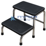Hospital double step foot stool with two black ribbed rubber treads on a stainless steel tubular frame with a cross bar and rubber feet