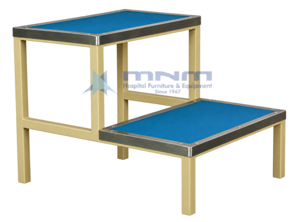 Hospital double step foot stool with blue anti-slip treads edged in stainless steel trim on a cream powder-coated square steel frame
