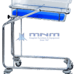 Baby cot with clear acrylic crib and blue mattress on a chrome tilting frame with a side tilt knob and six castors