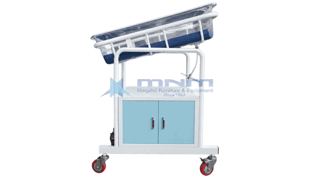 Baby cot with clear acrylic crib tilted on a white frame above a two door cabinet with light blue doors and four castors