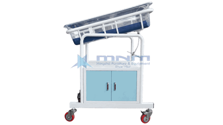 Baby cot with clear acrylic crib tilted on a white frame above a two door cabinet with light blue doors and four castors