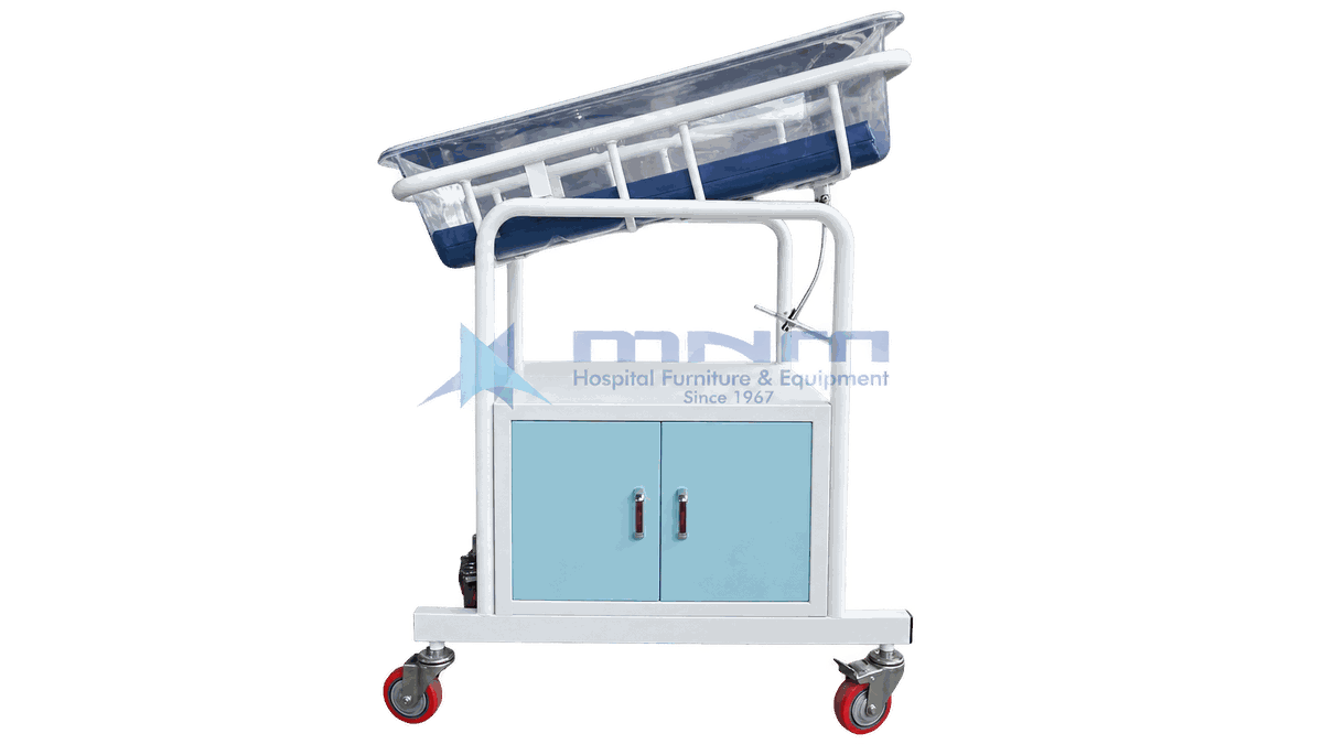 Baby Cot with Cabinet Base and Tilting Acrylic Crib Baby cot with clear acrylic crib tilted on a white frame above a two door cabinet with light blue doors and four castors