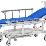 Emergency patient transfer trolley with gas-spring backrest raised, stainless steel side rails, IV pole, moulded under tray and central steering wheel
