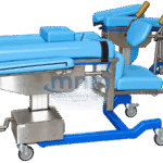Hydraulic delivery bed with light blue upholstery, padded knee crutch leg supports, detachable foot section on its own castors and a blue powder-coated base