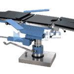 Hydraulic operating table in the flat position with head and leg extensions fitted and an arm board to one side