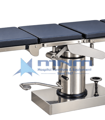 Manual operating table with navy four section upholstered top on a stainless steel frame, cylindrical hydraulic column with foot pump pedal, crank handles and rectangular stainless base