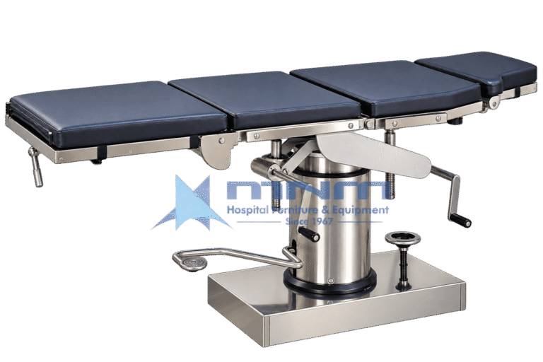 Manual operating table with navy four section upholstered top on a stainless steel frame, cylindrical hydraulic column with foot pump pedal, crank handles and rectangular stainless base