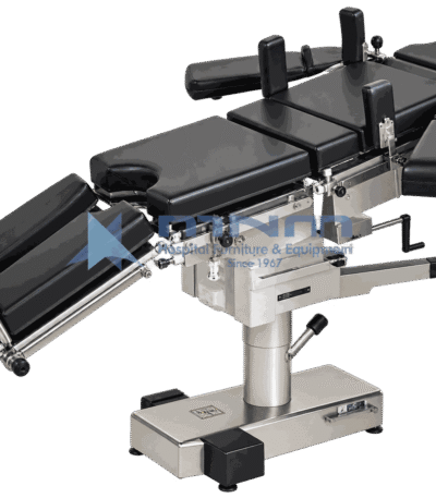 Operating table with black upholstered multi section top, shoulder supports, arm boards and leg troughs fitted, on a low rectangular stainless base with foot pedals