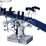 Operating table with navy upholstered top, padded stirrups and anaesthetic screen, controlled by twin handwheels on a conical chrome column and box base