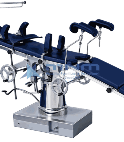 Operating table with navy upholstered top, padded stirrups and anaesthetic screen, controlled by twin handwheels on a conical chrome column and box base