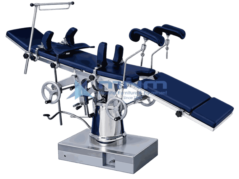 Operating table with navy upholstered top, padded stirrups and anaesthetic screen, controlled by twin handwheels on a conical chrome column and box base