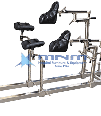 Stainless steel orthopaedic traction attachment with two padded boot holders on adjustable arms, padded leg supports, perineal post and a rail frame with castor