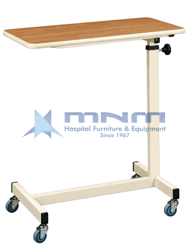 Hospital overbed table with wood-effect laminate top, moulded edge trim, cream powder-coated column with knob height lock and an H-shaped base on four castors