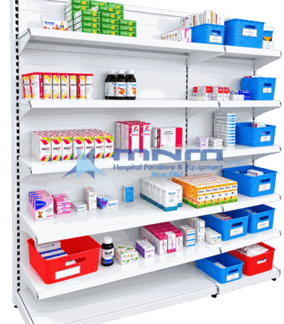 Single sided gondola rack with white slatted back panel and six shelves stocked with medicine cartons, syrup bottles and labelled dispensing baskets