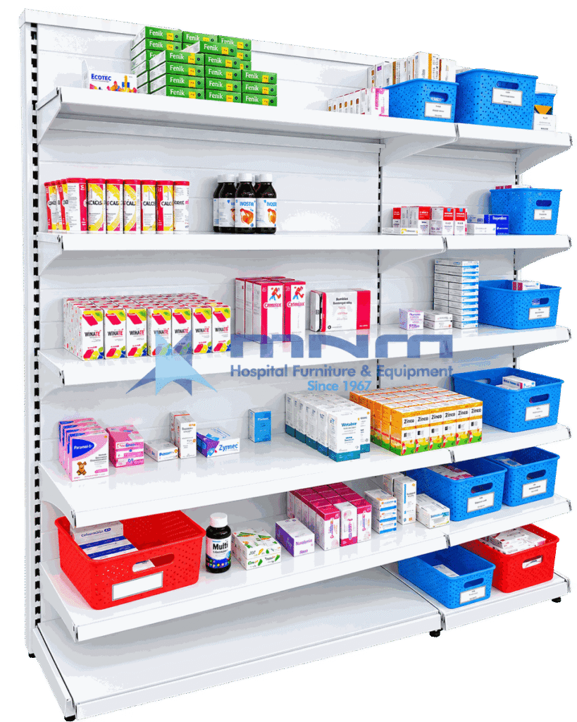 Single sided gondola rack with white slatted back panel and six shelves stocked with medicine cartons, syrup bottles and labelled dispensing baskets
