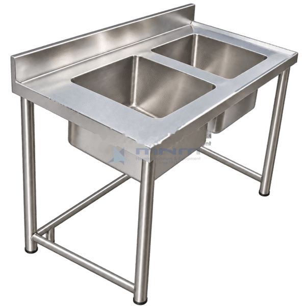 Stainless steel double bowl sink table on four tubular legs with a rear backsplash and lower cross bracing