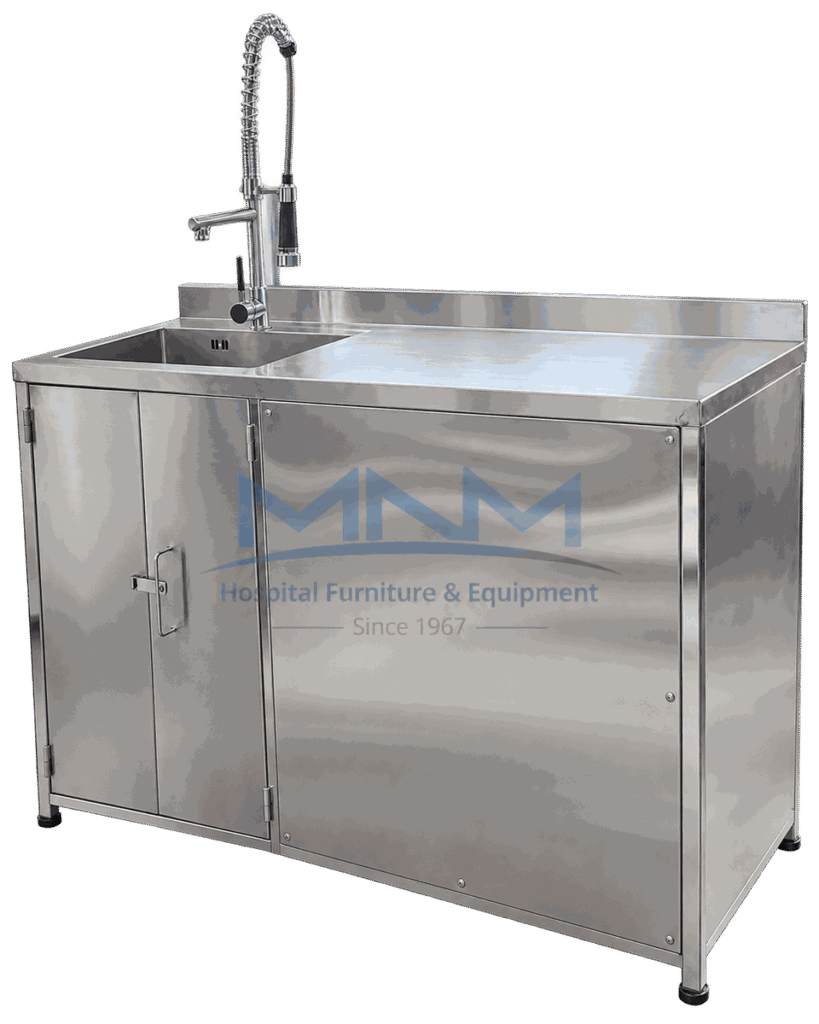 Stainless steel sink unit with a single bowl on the left, drainer worktop on the right, coiled pre-rinse spray tap, rear upstand and a two door cabinet below