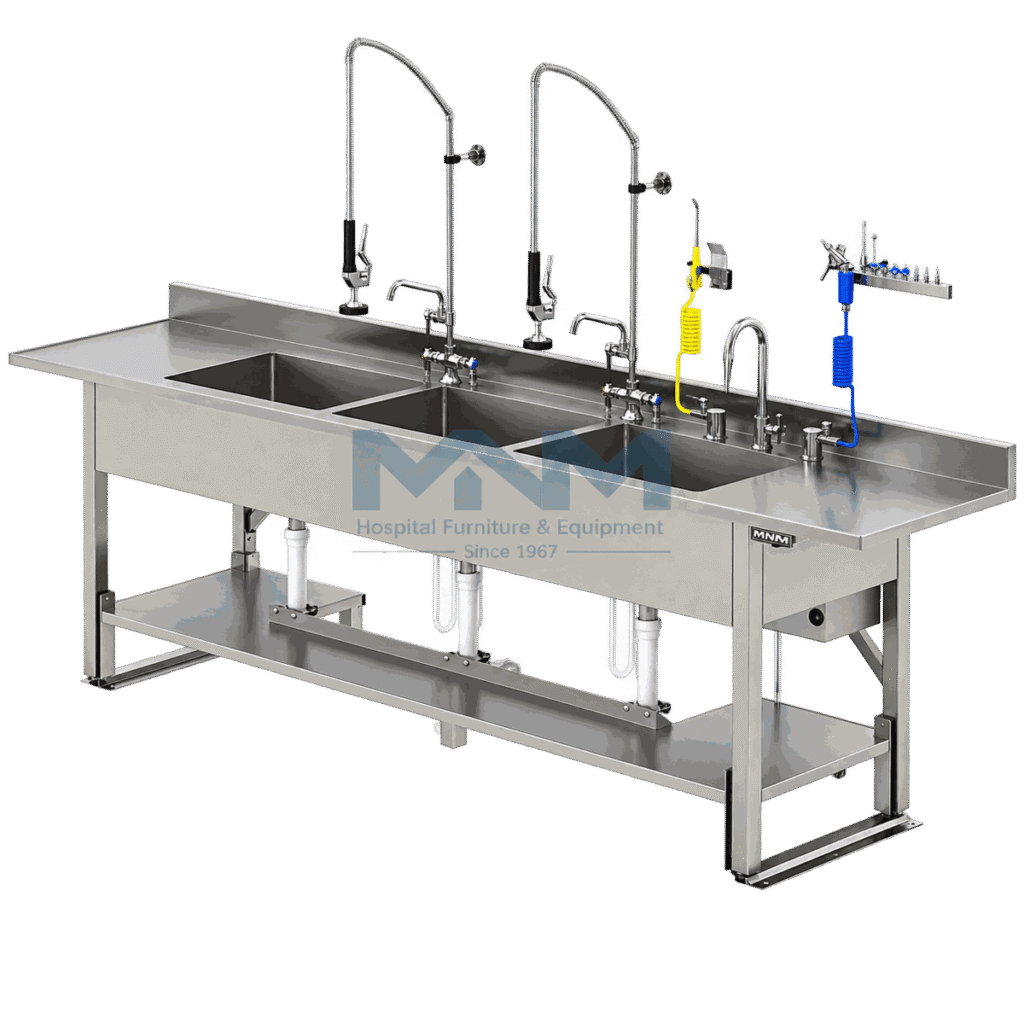 Long stainless steel three bowl instrument washing bench with two pre-rinse spray arms, air and water guns, drainer sections at each end and a lower shelf