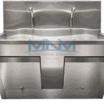 Stainless steel two station scrub sink with twin gooseneck taps, wave-profile backsplash and a lockable cabinet beneath the trough