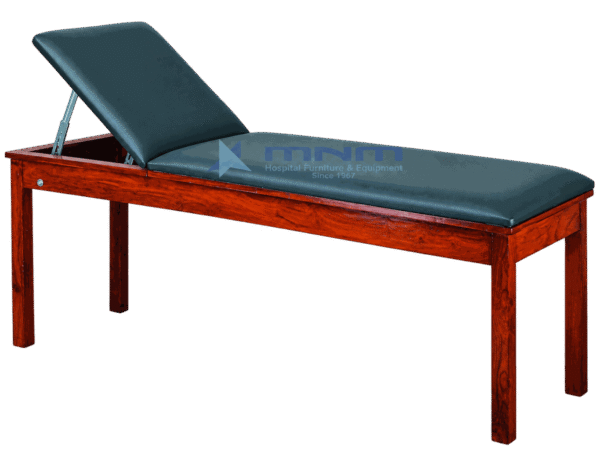 Examination couch with polished hardwood frame, dark green upholstery and backrest raised on a metal strut